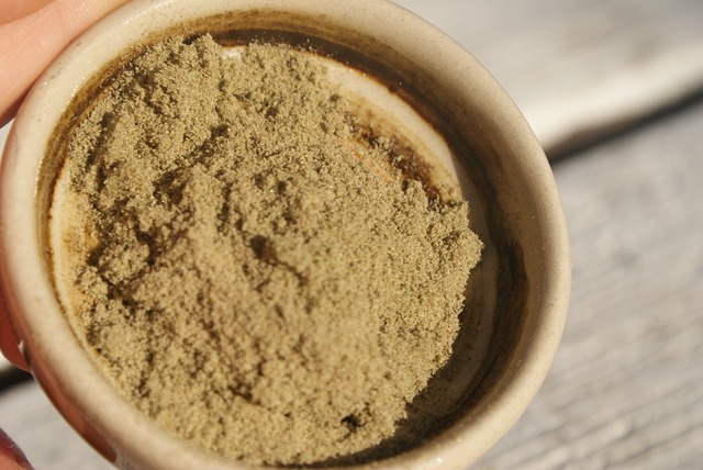 Person holding small bowl of kief.