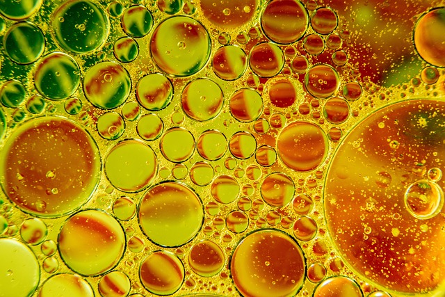 Oil bubbles in water with orange and yellow swirls