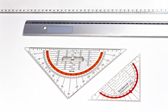 A collection of rulers, with one ruler placed on top of the others, creating a layered effect.