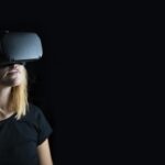 Woman experiencing virtual reality with headset on.