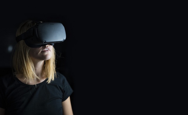 Woman experiencing virtual reality with headset on.